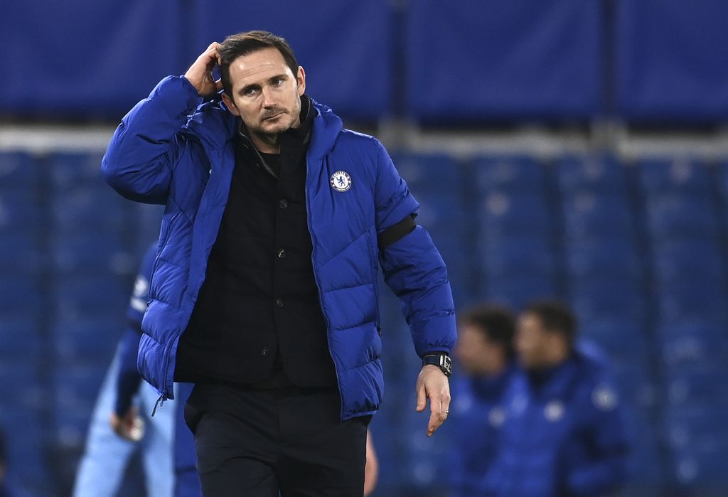 Chelsea's head coach Frank Lampard scratches his head after the English Premier League soccer match between Chelsea and Manchester City at Stamford Bridge, London, England, Sunday, Jan. 3, 2021. City won the match 3-1. (Andy Rain/Pool via AP)