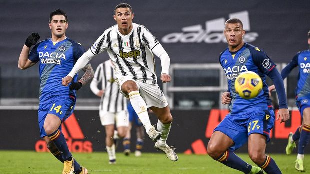 Juventus' Cristiano Ronaldo scores during the Italian Serie A soccer match between Juventus and Udinese at the Allianz Stadium in Turin, Italy, Sunday Jan. 3, 2021. (Marco Alpozzi/LaPresse via AP)