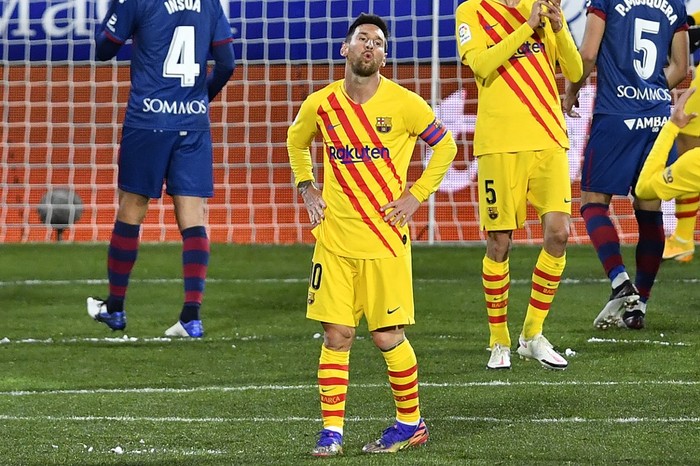 Barcelonas Argentinian forward Lionel Messi reacts after missing a goal opportunity during the Spanish League football match between Huesca and Barcelona at the El Alcoraz stadium in Huesca on January 3, 2021. (Photo by Pau BARRENA / AFP)