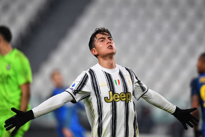 Paulo Dybala TURIN, ITALY - JANUARY 03: Paulo Dybala of Juventus F.C. celebrates after scoring their teams fourth goal during the Serie A match between Juventus and Udinese Calcio at Allianz Stadium on January 03, 2021 in Turin, Italy. Sporting stadiums around Italy remain under strict restrictions due to the Coronavirus Pandemic as Government social distancing laws prohibit fans inside venues resulting in games being played behind closed doors. (Photo by Valerio Pennicino/Getty Images)