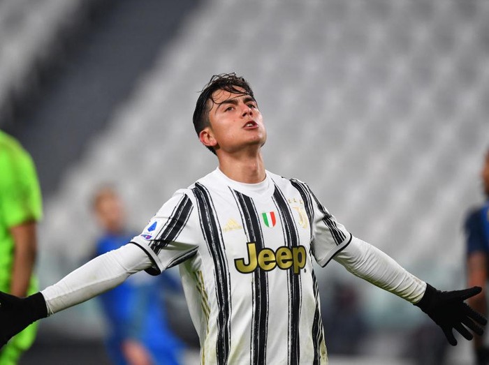 TURIN, ITALY - JANUARY 03: Paulo Dybala of Juventus F.C. celebrates after scoring their team's fourth goal during the Serie A match between Juventus and Udinese Calcio at Allianz Stadium on January 03, 2021 in Turin, Italy. Sporting stadiums around Italy remain under strict restrictions due to the Coronavirus Pandemic as Government social distancing laws prohibit fans inside venues resulting in games being played behind closed doors. (Photo by Valerio Pennicino/Getty Images)