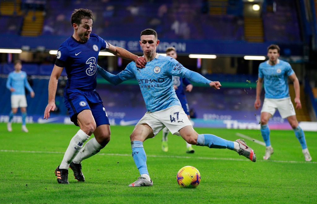 LONDON, ENGLAND - JANUARY 03: Phil Foden of Manchester City is challenged by Cesar Azpilicueta of Chelsea during the Premier League match between Chelsea and Manchester City at Stamford Bridge on January 03, 2021 in London, England. The match will be played without fans, behind closed doors as a Covid-19 precaution. (Photo by Ian Walton - Pool/Getty Images)