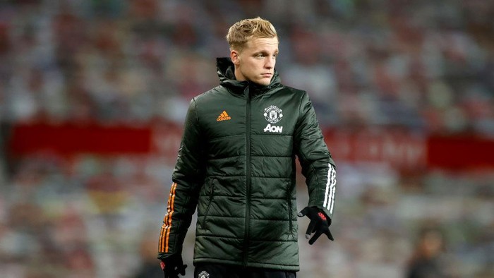 MANCHESTER, ENGLAND - DECEMBER 12: Donny Van De Beek of Manchester United looks on during the warm up prior to the Premier League match between Manchester United and Manchester City at Old Trafford on December 12, 2020 in Manchester, England. The match will be played without fans, behind closed doors as a Covid-19 precaution. (Photo by Phil Noble - Pool/Getty Images)