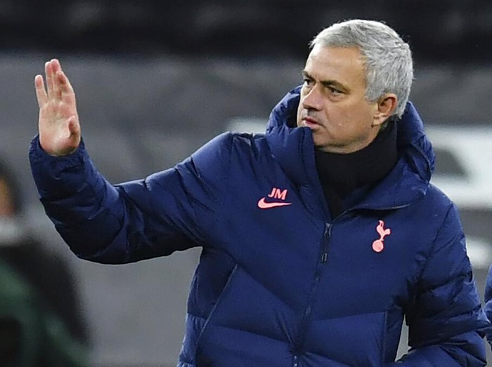 Tottenham's manager Jose Mourinho gestures as his team won the EFL Cup semi-final soccer match between Tottenham Hotspur and Brentford at Tottenham Hotspur Stadium in London, England, Tuesday, Jan. 5, 2021. (Glyn Kirk/Pool via AP)