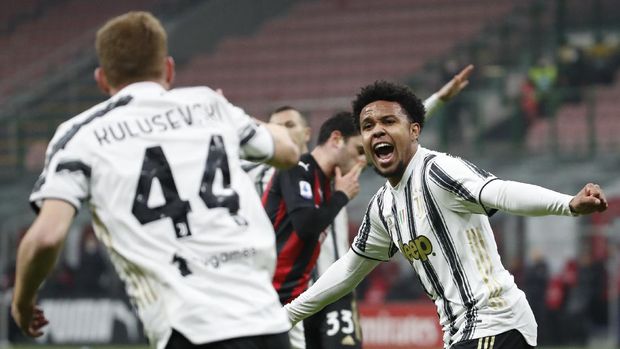 Juventus' Weston McKennie, right, celebrates with Juventus' Dejan Kulusevski after scoring his side's third goal during the Serie A soccer match between AC Milan and Juventus at the San Siro stadium, in Milan, Italy, Wednesday, Jan. 6, 2021. (AP Photo/Antonio Calanni)