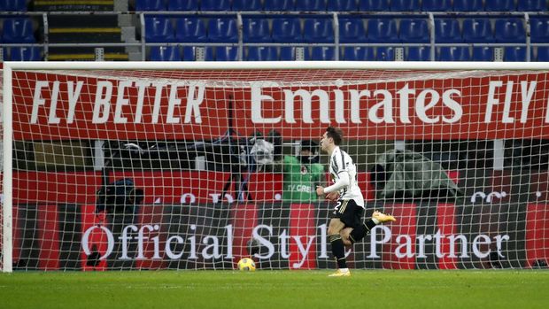 Juventus' Federico Chiesa celebrates after scoring his side's opening goal during the Serie A soccer match between AC Milan and Juventus at the San Siro stadium, in Milan, Italy, Wednesday, Jan. 6, 2021. (AP Photo/Antonio Calanni)
