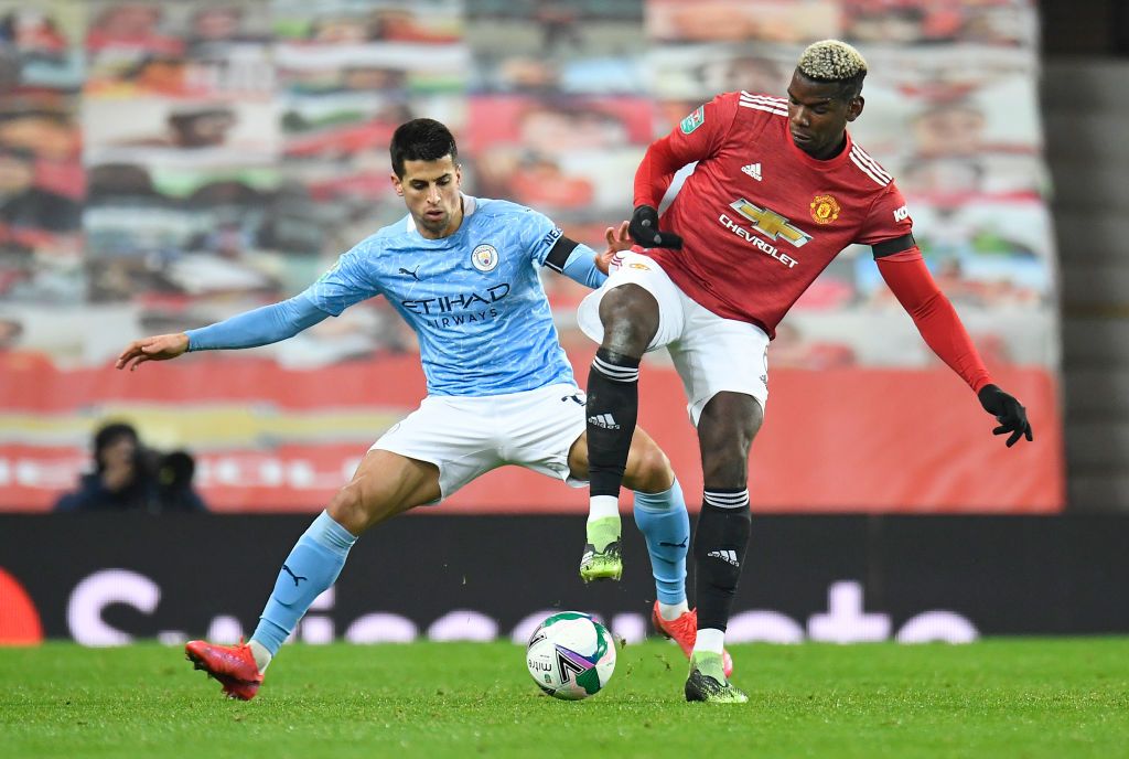 MANCHESTER, ENGLAND - NOVEMBER 08: Joao Cancelo of Manchester City on the ball during the Premier League match between Manchester City and Liverpool at Etihad Stadium on November 08, 2020 in Manchester, England. Sporting stadiums around the UK remain under strict restrictions due to the Coronavirus Pandemic as Government social distancing laws prohibit fans inside venues resulting in games being played behind closed doors. (Photo by Clive Brunskill/Getty Images)