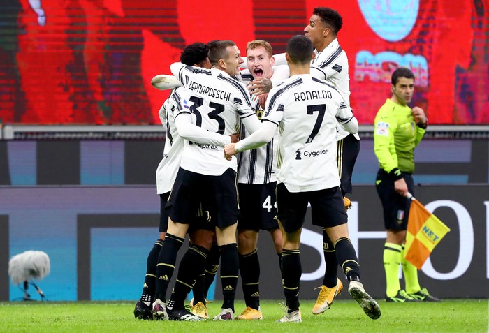 MILAN, ITALY - JANUARY 06: Weston McKennie of Juventus F.C. celebrates after scoring his sides third goal with Dejan Kulusevski of Juventus F.C. during the Serie A match between AC Milan and Juventus at Stadio Giuseppe Meazza on January 06, 2021 in Milan, Italy. Sporting stadiums around Italy remain under strict restrictions due to the Coronavirus Pandemic as Government social distancing laws prohibit fans inside venues resulting in games being played behind closed doors. (Photo by Marco Luzzani/Getty Images)
