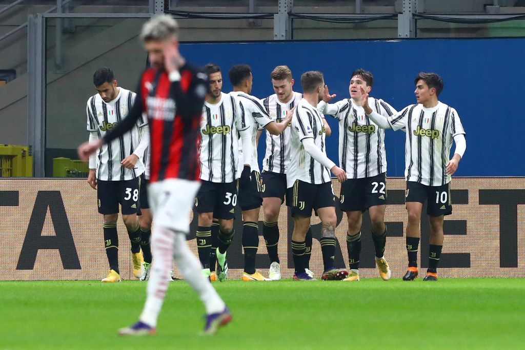 MILAN, ITALY - JANUARY 06: Federico Chiesa of Juventus F.C. celebrates after he scores his sides first goal during the Serie A match between AC Milan and Juventus at Stadio Giuseppe Meazza on January 06, 2021 in Milan, Italy. Sporting stadiums around Italy remain under strict restrictions due to the Coronavirus Pandemic as Government social distancing laws prohibit fans inside venues resulting in games being played behind closed doors. (Photo by Marco Luzzani/Getty Images)