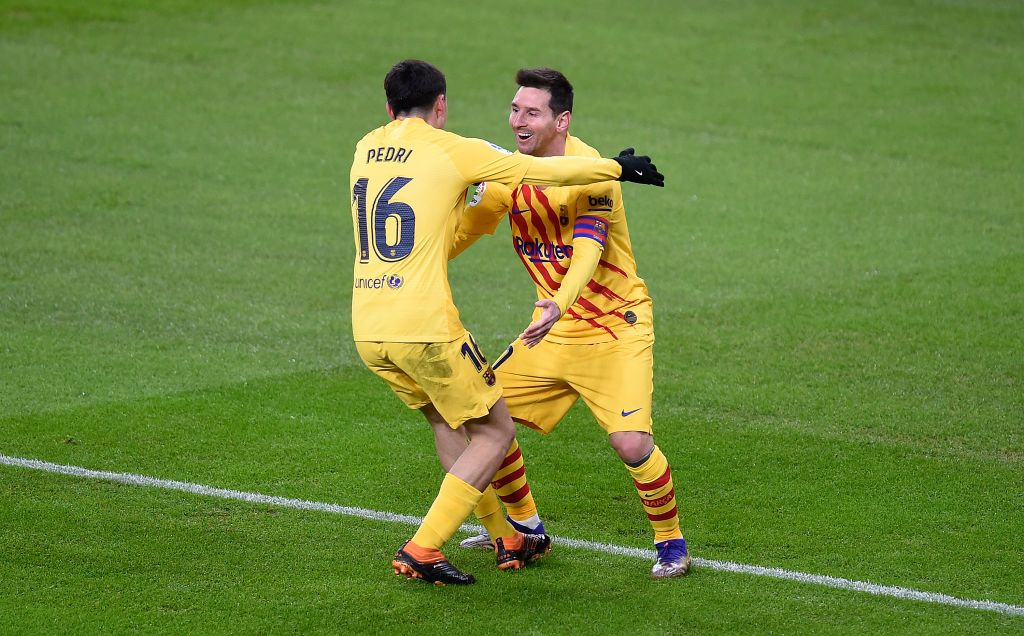 BILBAO, SPAIN - JANUARY 06: Lionel Messi of Barcelona celebrates with Pedri of Barcelona after he scores his team's second goal during the La Liga Santander match between Athletic Club and FC Barcelona at Estadio de San Mames on January 06, 2021 in Bilbao, Spain. Sporting stadiums around Spain remain under strict restrictions due to the Coronavirus Pandemic as Government social distancing laws prohibit fans inside venues resulting in games being played behind closed doors. (Photo by Juan Manuel Serrano Arce/Getty Images)