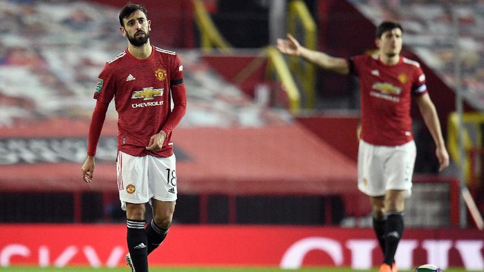 Manchester United MANCHESTER, ENGLAND - JANUARY 06: Bruno Fernandes of Manchester United reacts after Manchester City score their first goal of the game during the Carabao Cup Semi Final match between Manchester United and Manchester City at Old Trafford on January 06, 2021 in Manchester, England. The match will be played without fans, behind closed doors as a Covid-19 precaution. (Photo by Peter Powell - Pool/Getty Images)
