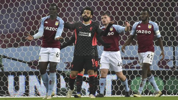 Liverpool's Mohamed Salah gestures after his goal was disallowed during the FA Cup 3rd round soccer match between Aston Villa and Liverpool at Villa Park stadium in Birmingham, England, Friday, Jan. 8, 2021. (AP Photo/Rui Vieira)