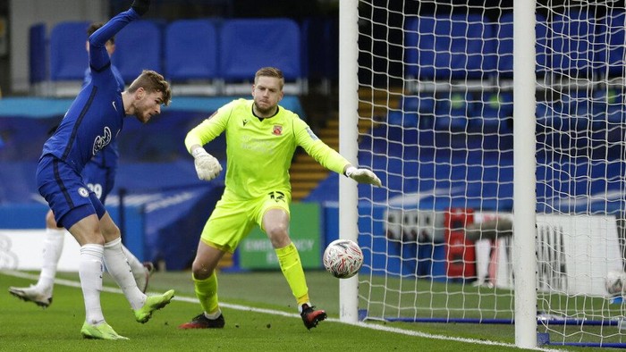 Chelseas Timo Werner, left, scores his sides second goal during the English FA Cup third round soccer match between Chelsea and Morecambe at Stamford Bridge Stadium in London, Sunday, Jan. 10, 2021. (AP Photo/Matt Dunham)
