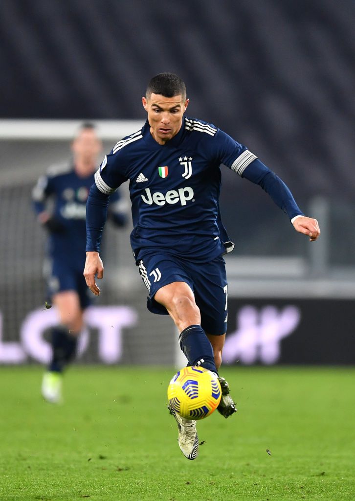 TURIN, ITALY - JANUARY 10: Cristiano Ronaldo of Juventus F.C. controls the ball during the Serie A match between Juventus and US Sassuolo at Allianz Stadium on January 10, 2021 in Turin, Italy. Sporting stadiums around Italy remain under strict restrictions due to the Coronavirus Pandemic as Government social distancing laws prohibit fans inside venues resulting in games being played behind closed doors. (Photo by Valerio Pennicino/Getty Images )