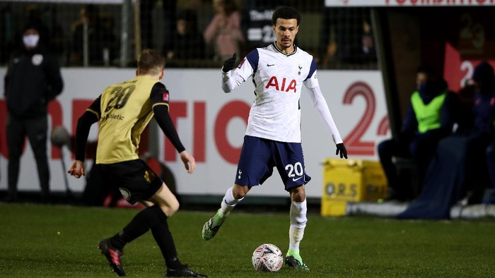CROSBY, ENGLAND - JANUARY 10: Dele Alli of Tottenham Hotspur is closed down by James Devine of Marine during the FA Cup Third Round match between Marine and Tottenham Hotspur at Rossett Park on January 10, 2021 in Crosby, England. Sporting stadiums around England remain under strict restrictions due to the Coronavirus Pandemic as Government social distancing laws prohibit fans inside venues resulting in games being played behind closed doors. (Photo by Clive Brunskill/Getty Images)