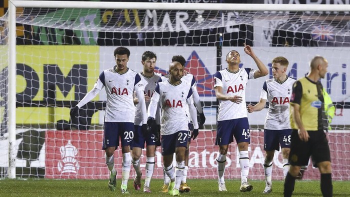 Tottenhams Carlos Vinicius points to the sky as he celebrates scoring his sides first goal during the English FA Cup third round soccer match between Marine and Tottenham Hotspur at Rossett Park stadium in Crosby, Liverpool, Sunday, Jan. 10, 2021. (Martin Rickett/Pool via AP)