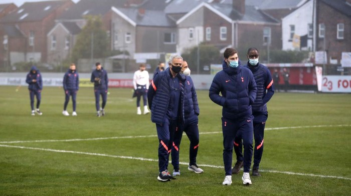 CROSBY, ENGLAND - JANUARY 10: Jose Mourinho, Manager of Tottenham Hotspur inspects the pitch with his players ahead of the FA Cup Third Round match between Marine and Tottenham Hotspur at Rossett Park on January 10, 2021 in Crosby, England. Sporting stadiums around England remain under strict restrictions due to the Coronavirus Pandemic as Government social distancing laws prohibit fans inside venues resulting in games being played behind closed doors. (Photo by Martin Rickett - Pool/Getty Images)