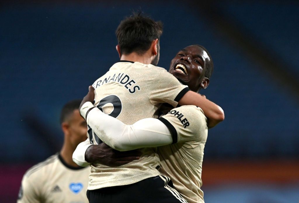 BIRMINGHAM, ENGLAND - JULY 09: Paul Pogba of Manchester United celebrates with Bruno Fernandes after scoring his team's third goal during the Premier League match between Aston Villa and Manchester United at Villa Park on July 09, 2020 in Birmingham, England. Football Stadiums around Europe remain empty due to the Coronavirus Pandemic as Government social distancing laws prohibit fans inside venues resulting in all fixtures being played behind closed doors. (Photo by Shaun Botterill/Getty Images)