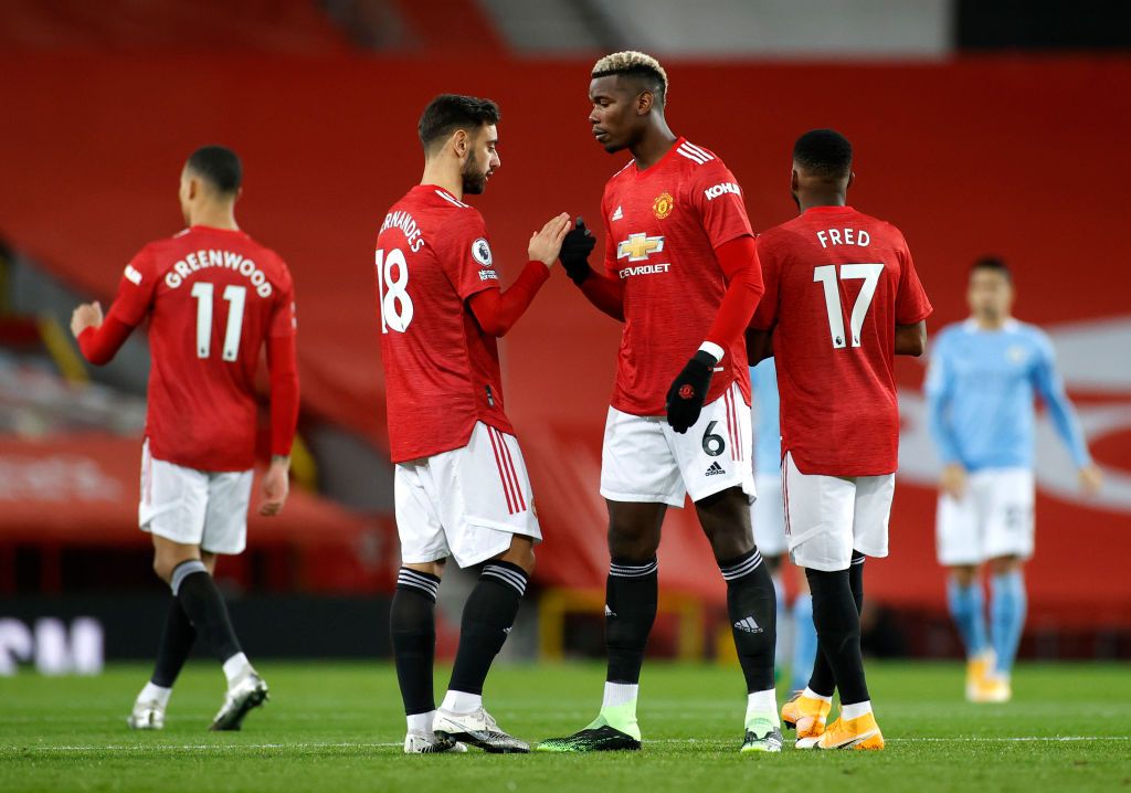 BIRMINGHAM, ENGLAND - JULY 09: Paul Pogba of Manchester United celebrates with Bruno Fernandes after scoring his team's third goal during the Premier League match between Aston Villa and Manchester United at Villa Park on July 09, 2020 in Birmingham, England. Football Stadiums around Europe remain empty due to the Coronavirus Pandemic as Government social distancing laws prohibit fans inside venues resulting in all fixtures being played behind closed doors. (Photo by Shaun Botterill/Getty Images)