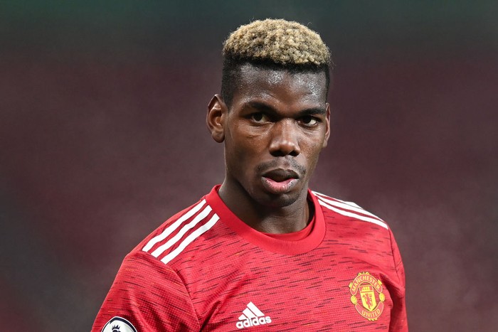 MANCHESTER, ENGLAND - DECEMBER 29: Paul Pogba of Manchester United in action during the Premier League match between Manchester United and Wolverhampton Wanderers at Old Trafford on December 29, 2020 in Manchester, England. The match will be played without fans, behind closed doors as a Covid-19 precaution. (Photo by Michael Regan/Getty Images)