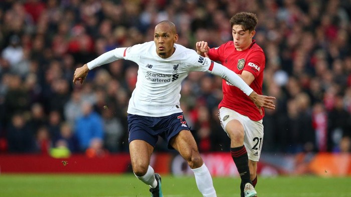 MANCHESTER, ENGLAND - OCTOBER 20: Fabinho of Liverpool looks to break past Daniel James of Manchester United during the Premier League match between Manchester United and Liverpool FC at Old Trafford on October 20, 2019 in Manchester, United Kingdom. (Photo by Alex Livesey/Getty Images)