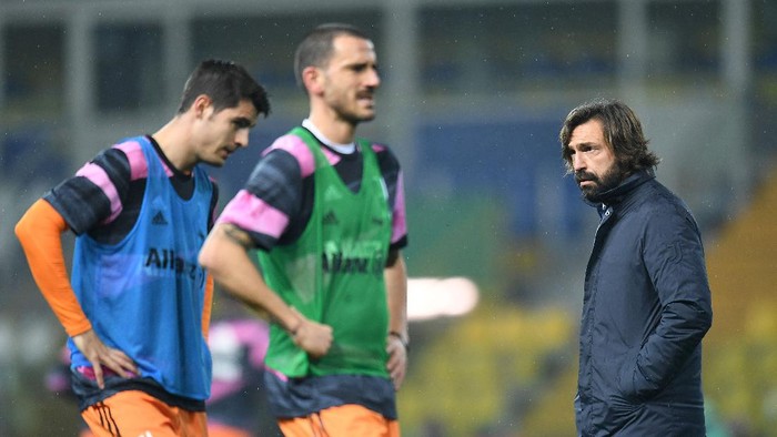 PARMA, ITALY - DECEMBER 19: Andrea Pirlo head coach of Juventus looks on during the Serie A match between Parma Calcio and Juventus at Stadio Ennio Tardini on December 19, 2020 in Parma, Italy. Sporting stadiums around Italy  remain under strict restrictions due to the Coronavirus Pandemic as Government social distancing laws prohibit fans inside venues resulting in games being played behind closed doors. (Photo by Alessandro Sabattini/Getty Images)