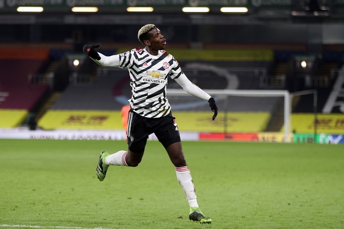 BURNLEY, ENGLAND - JANUARY 12: Paul Pogba of Manchester United celebrates after scoring their teams first goal during the Premier League match between Burnley and Manchester United at Turf Moor on January 12, 2021 in Burnley, England. Sporting stadiums around England remain under strict restrictions due to the Coronavirus Pandemic as Government social distancing laws prohibit fans inside venues resulting in games being played behind closed doors. (Photo by Clive Brunskill/Getty Images)