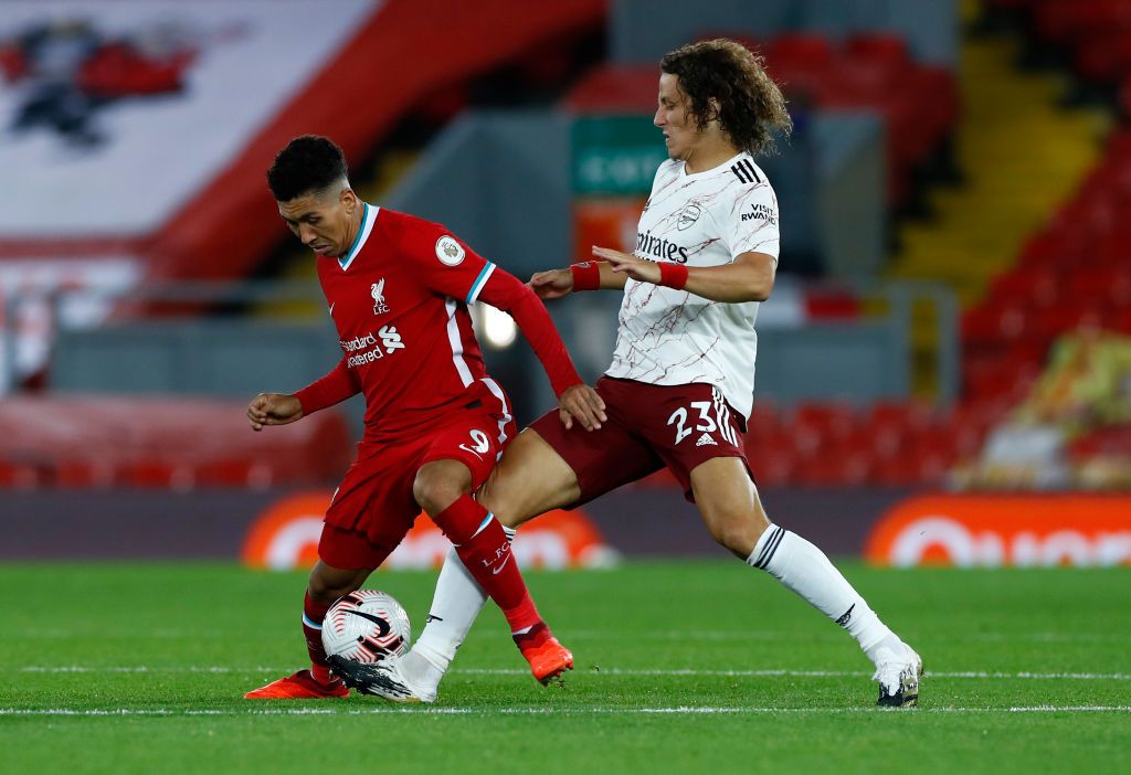 LONDON, ENGLAND - AUGUST 01: David Luiz of Arsenal embraces Mikel Arteta, Manager of Arsenal after their teams victory in the Heads Up FA Cup Final match between Arsenal and Chelsea at Wembley Stadium on August 01, 2020 in London, England. Football Stadiums around Europe remain empty due to the Coronavirus Pandemic as Government social distancing laws prohibit fans inside venues resulting in all fixtures being played behind closed doors. (Photo by Catherine Ivill/Getty Images)