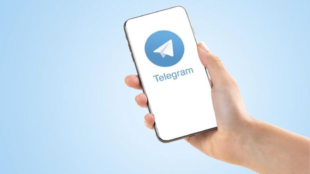 Poltava, Ukraine - July 28, 2018: Telegram application logo on smartphone in hands passport verification new feature technology
