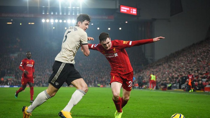 LIVERPOOL, ENGLAND - JANUARY 19: Harry Maguire of Manchester United and Andrew Robertson of Liverpool in action during the Premier League match between Liverpool FC and Manchester United at Anfield on January 19, 2020 in Liverpool, United Kingdom. (Photo by Michael Regan/Getty Images)