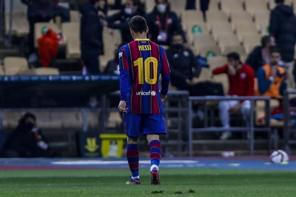 Barcelona's Lionel Messi walks out of the pitch after being shown a red card during the Spanish Supercopa final soccer match against FC Barcelona at La Cartuja stadium in Seville, Spain, Sunday, Jan. 17, 2021. (AP Photo/Miguel Morenatti)