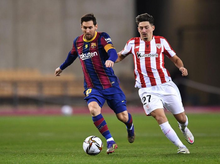 SEVILLE, SPAIN - JANUARY 17: Lionel Messi of Barcelona reacts during the Supercopa de Espana Final match between FC Barcelona and Athletic Club at Estadio de La Cartuja on January 17, 2021 in Seville, Spain. Sporting stadiums around Spain remain under strict restrictions due to the Coronavirus Pandemic as Government social distancing laws prohibit fans inside venues resulting in games being played behind closed doors. (Photo by David Ramos/Getty Images)