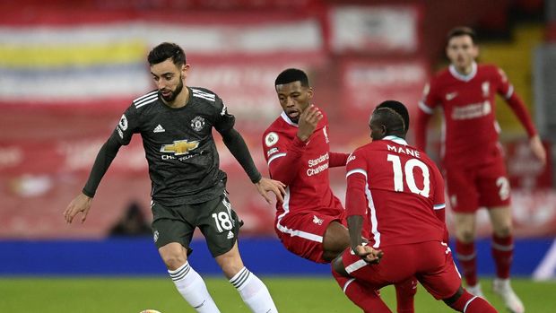 Manchester United's Bruno Fernandes controls the ball during the English Premier League soccer match between Liverpool and Manchester United at Anfield Stadium, Liverpool, England, Sunday, Jan. 17, 2021. (Michael Regan/Pool via AP)