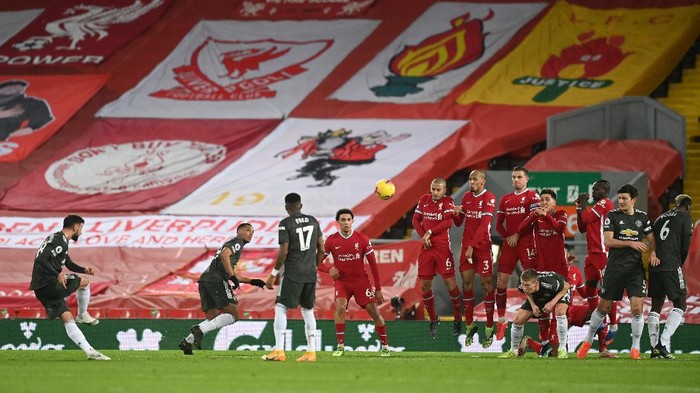 LIVERPOOL, ENGLAND - JANUARY 17: Bruno Fernandes of Manchester United has a shot from a free kick during the Premier League match between Liverpool and Manchester United at Anfield on January 17, 2021 in Liverpool, England. Sporting stadiums around England remain under strict restrictions due to the Coronavirus Pandemic as Government social distancing laws prohibit fans inside venues resulting in games being played behind closed doors. (Photo by Michael Regan/Getty Images)