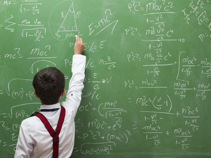 Little professor solving math duduk kasus on blackboard