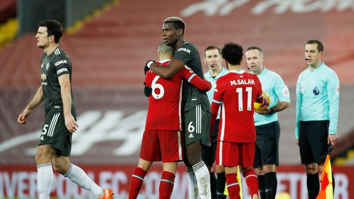 Liverpool vs Manchester United LIVERPOOL, ENGLAND - JANUARY 17: Paul Pogba of Manchester United and Thiago Alcantara of Liverpool interact after the Premier League match between Liverpool and Manchester United at Anfield on January 17, 2021 in Liverpool, England. Sporting stadiums around England remain under strict restrictions due to the Coronavirus Pandemic as Government social distancing laws prohibit fans inside venues resulting in games being played behind closed doors. (Photo by Phil Noble - Pool/Getty Images)