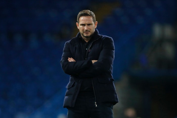 LONDON, ENGLAND - DECEMBER 05: Frank Lampard, Manager of Chelsea looks on as his team warms up ahead of the Premier League match between Chelsea and Leeds United at Stamford Bridge on December 05, 2020 in London, England. A limited number of fans are welcomed back to stadiums to watch elite football across England. This was following easing of restrictions on spectators in tiers one and two areas only. (Photo by Matthew Childs - Pool/Getty Images)