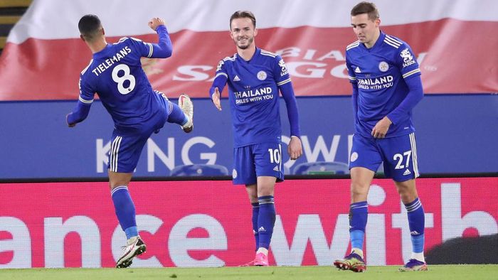Leicester City LEICESTER, ENGLAND - JANUARY 16: James Maddison of Leicester City celebrates with team mates Youri Tielemans (L) and Timothy Castagne (R) of Leicester City after scoring their sides first goal during the Premier League match between Leicester City and Southampton at The King Power Stadium on January 16, 2021 in Leicester, England. Sporting stadiums around England remain under strict restrictions due to the Coronavirus Pandemic as Government social distancing laws prohibit fans inside venues resulting in games being played behind closed doors. (Photo by Alex Pantling/Getty Images)