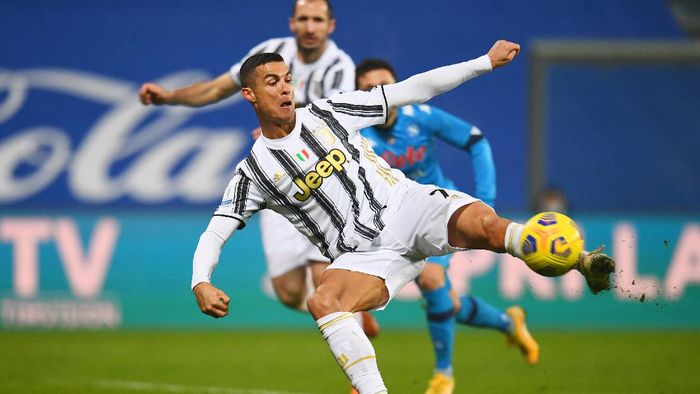Cristiano Ronaldo REGGIO NELLEMILIA, ITALY - JANUARY 20: Cristiano Ronaldo of Juventus scores their sides first goal during the Italian PS5 Supercup match between Juventus and SSC Napoli at Mapei Stadium - Citta del Tricolore on January 20, 2021 in Reggio nellEmilia, Italy. Sporting stadiums around Italy remain under strict restrictions due to the Coronavirus Pandemic as Government social distancing laws prohibit fans inside venues resulting in games being played behind closed doors. (Photo by Claudio Villa/Getty Images)