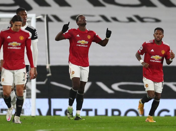 LONDON, ENGLAND - JANUARY 20: Paul Pogba of Manchester United celebrates after scoring their sides second goal during the Premier League match between Fulham and Manchester United at Craven Cottage on January 20, 2021 in London, England. Sporting stadiums around the UK remain under strict restrictions due to the Coronavirus Pandemic as Government social distancing laws prohibit fans inside venues resulting in games being played behind closed doors. (Photo by Clive Rose/Getty Images)