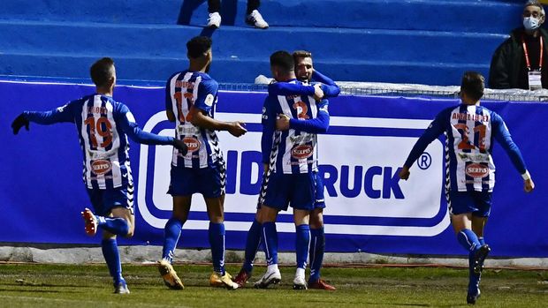 Alcoyano's Jose Solbes, centre celebrates with team mates after scoring the equaliser, his side's first goal during a Spanish Copa del Rey round of 32 soccer match between Alcoyano and Real Madrid at the El Collao stadium in Alcoy, Spain, Wednesday Jan. 20, 2021. (AP Photo/Jose Breton)