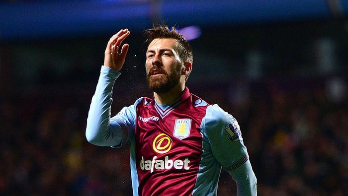 BIRMINGHAM, ENGLAND - JANUARY 13:  A dejected Antonio Luna of Aston Villa reacts after the Arsenal score a second during the Barclays Premier League match between Aston Villa and Arsenal at Villa Park on January 13, 2014 in Birmingham, England.  (Photo by Michael Regan/Getty Images)