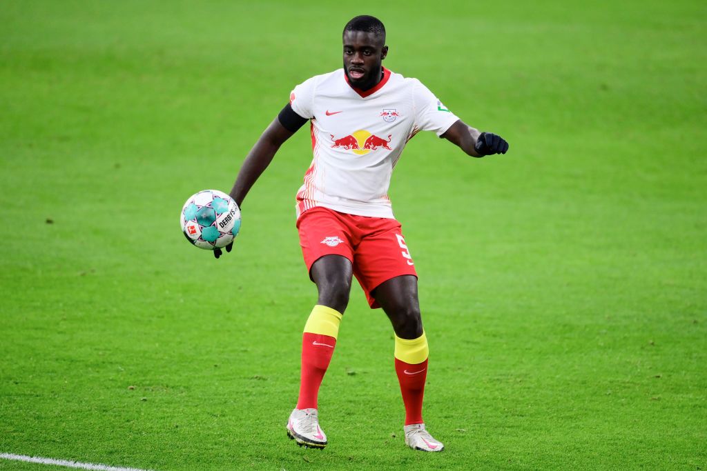 LEIPZIG, GERMANY - DECEMBER 19: Dayot Upamecano of RB Leipzig controls the ball during the Bundesliga match between RB Leipzig and 1. FC Koeln at Red Bull Arena on December 19, 2020 in Leipzig, Germany. Sporting stadiums around Germany remain under strict restrictions due to the Coronavirus Pandemic as Government social distancing laws prohibit fans inside venues resulting in games being played behind closed doors. (Photo by Oliver Hardt/Getty Images)