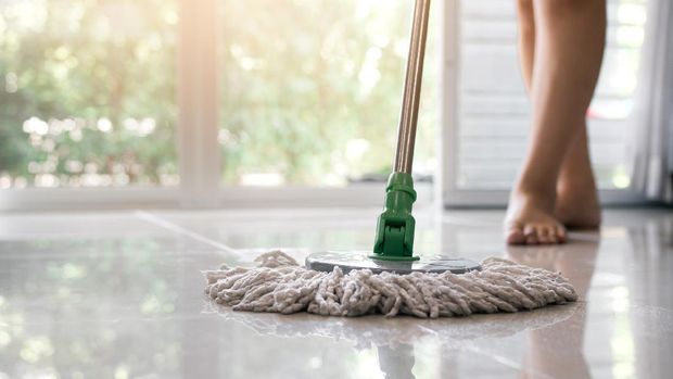 Asian women clean the public using mop tiles.