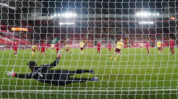 Soccer Football - Premier League - Liverpool v Burnley - Anfield, Liverpool, Britain - January 21, 2021 Burnley's Ashley Barnes scores their first goal from the penalty spot Pool via REUTERS/Jon Super EDITORIAL USE ONLY. No use with unauthorized audio, video, data, fixture lists, club/league logos or 'live' services. Online in-match use limited to 75 images, no video emulation. No use in betting, games or single club /league/player publications.  Please contact your account representative for further details.