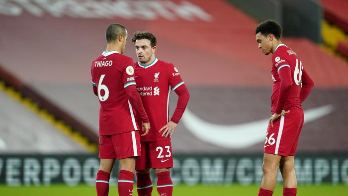 LIVERPOOL, ENGLAND - JANUARY 21: (L - R) Thiago Alcantara, Xherdan Shaqiri and Trent Alexander-Arnold of Liverpool prepare to take a free kick during the Premier League match between Liverpool and Burnley at Anfield on January 21, 2021 in Liverpool, England. Sporting stadiums around the UK remain under strict restrictions due to the Coronavirus Pandemic as Government social distancing laws prohibit fans inside venues resulting in games being played behind closed doors. (Photo by Jon Super - Pool/Getty Images)