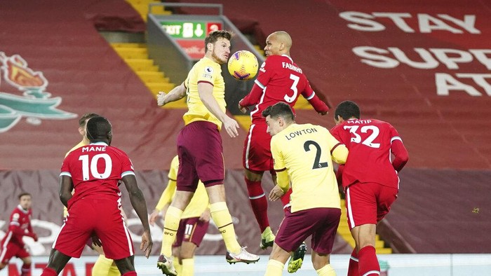Players fight for the ball during the English Premier League soccer match between Liverpool and Burnley in Liverpool, England, Thursday, Jan. 21, 2021. (AP Photo/Jon Super, Pool)
