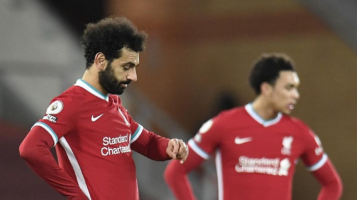 LIVERPOOL, ENGLAND - JANUARY 21: Mohamed Salah of Liverpool reacts after Ashley Barnes (Not pictured) of Burnley scores their sides first goal from the penalty spot during the Premier League match between Liverpool and Burnley at Anfield on January 21, 2021 in Liverpool, England. Sporting stadiums around the UK remain under strict restrictions due to the Coronavirus Pandemic as Government social distancing laws prohibit fans inside venues resulting in games being played behind closed doors. (Photo by Peter Powell - Pool/Getty Images)
