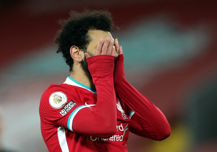 LIVERPOOL, ENGLAND - JANUARY 21: Mohamed Salah of Liverpool reacts during the Premier League match between Liverpool and Burnley at Anfield on January 21, 2021 in Liverpool, England. Sporting stadiums around the UK remain under strict restrictions due to the Coronavirus Pandemic as Government social distancing laws prohibit fans inside venues resulting in games being played behind closed doors. (Photo by Clive Brunskill/Getty Images)