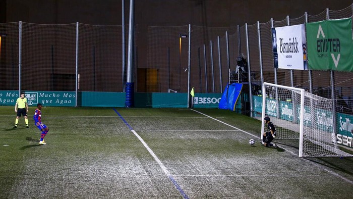 Barcelonas Ousmane Dembele attempts and fails to score a penalty shot during a Spanish Copa del Rey round of 32 soccer match between Cornella and FC Barcelona at the Nou Municipal stadium in Cornella, Spain, Thursday, Jan. 21, 2021. (AP Photo/Joan Monfort)